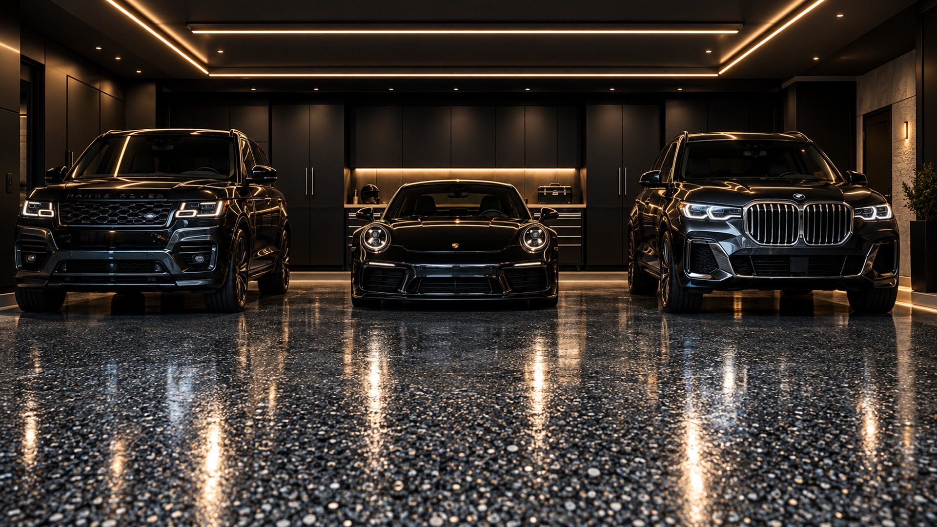 Dark flake garage floor with a seamless finish under warm lighting